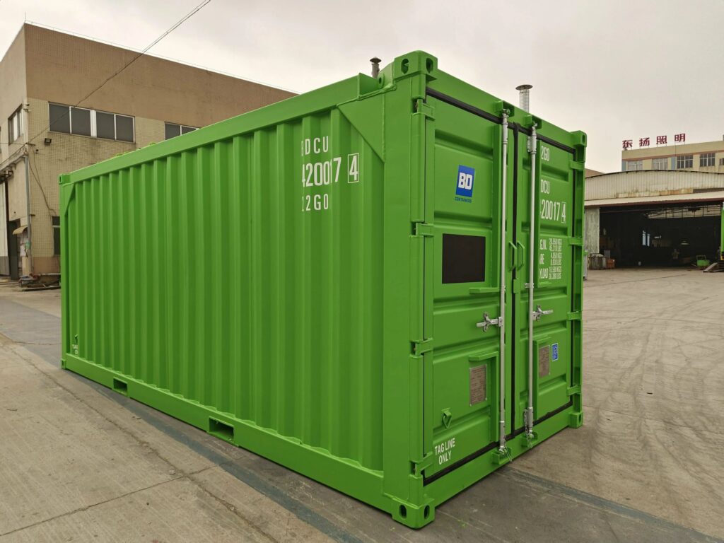 Green offshore container standing in a container yard