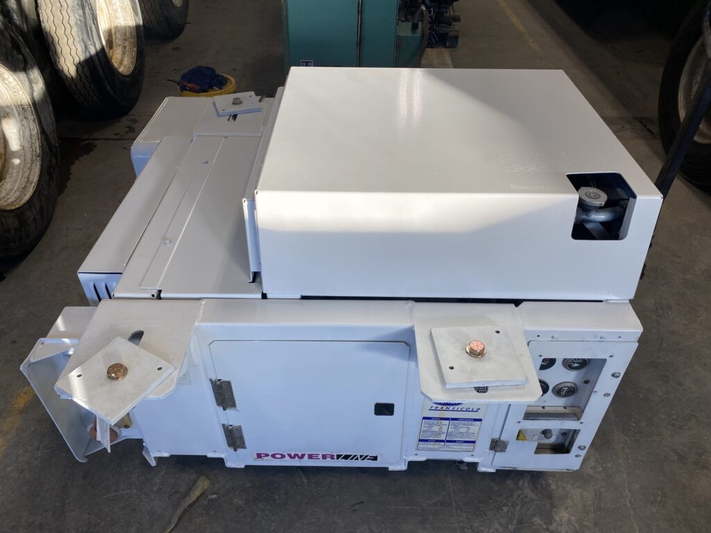 White PowerLINE genset unit with mounting brackets on a workshop floor
